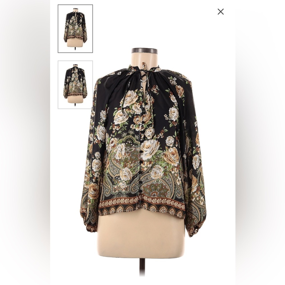 Long sleeved floral top with optional tie closures.